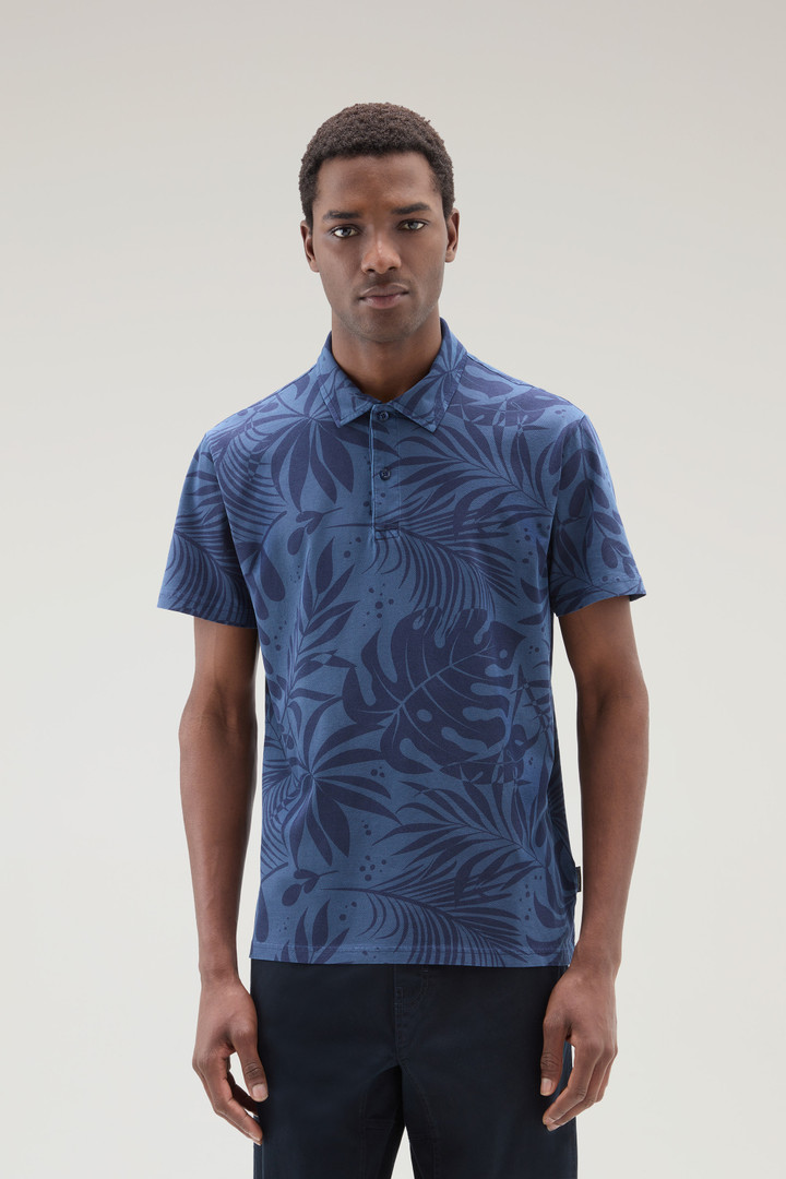 Garment-Dyed Polo Shirt in Stretch Cotton with a Tropical Print Blue photo 1 | Woolrich