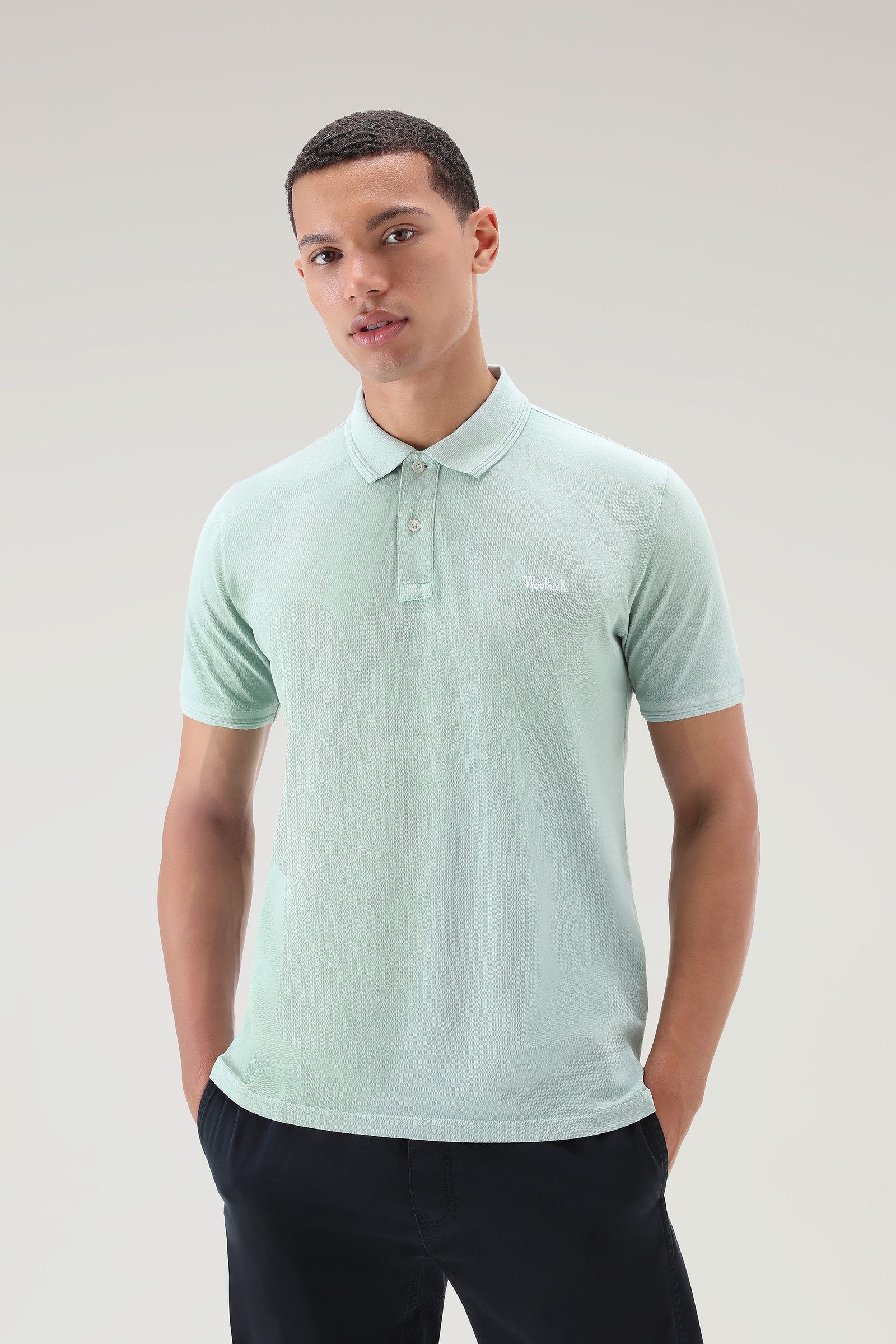 Polo Mackinack tinta in capo in piqué di cotone elasticizzato verde | Woolrich