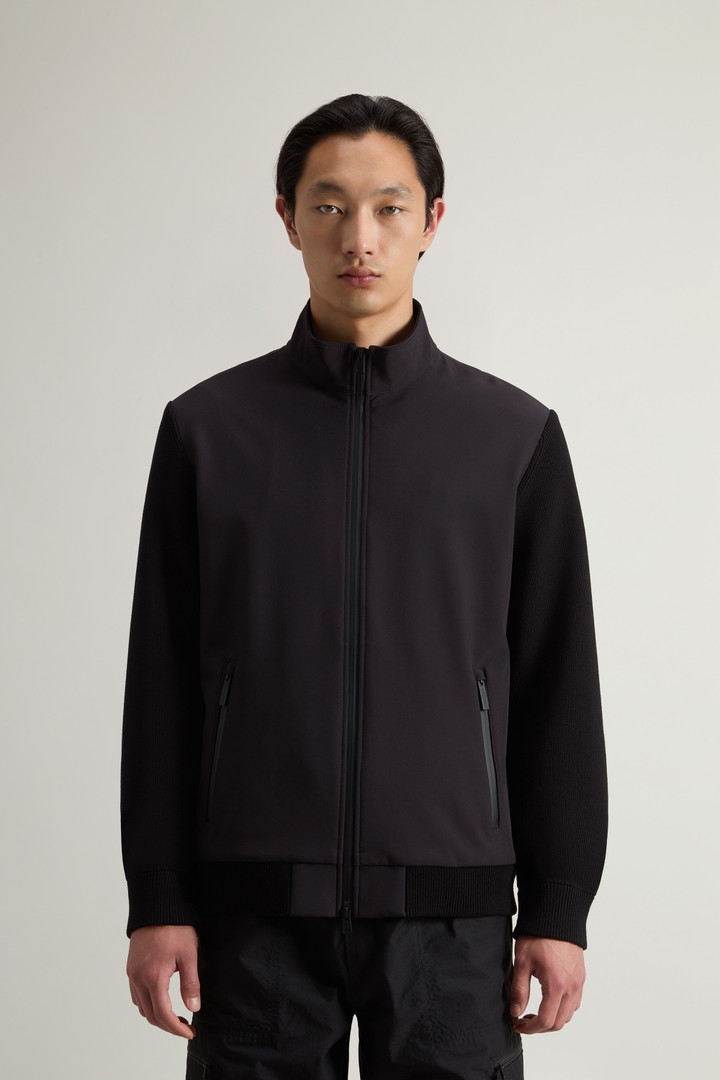 Hybrid Jacket in Tech Softshell Black photo 1 | Woolrich